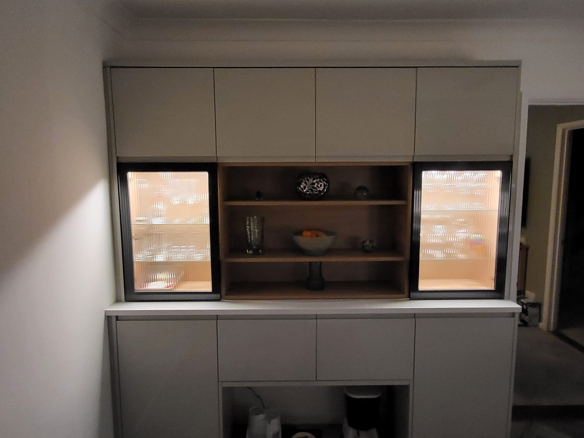 Built-in shelving unit with cabinet lighting