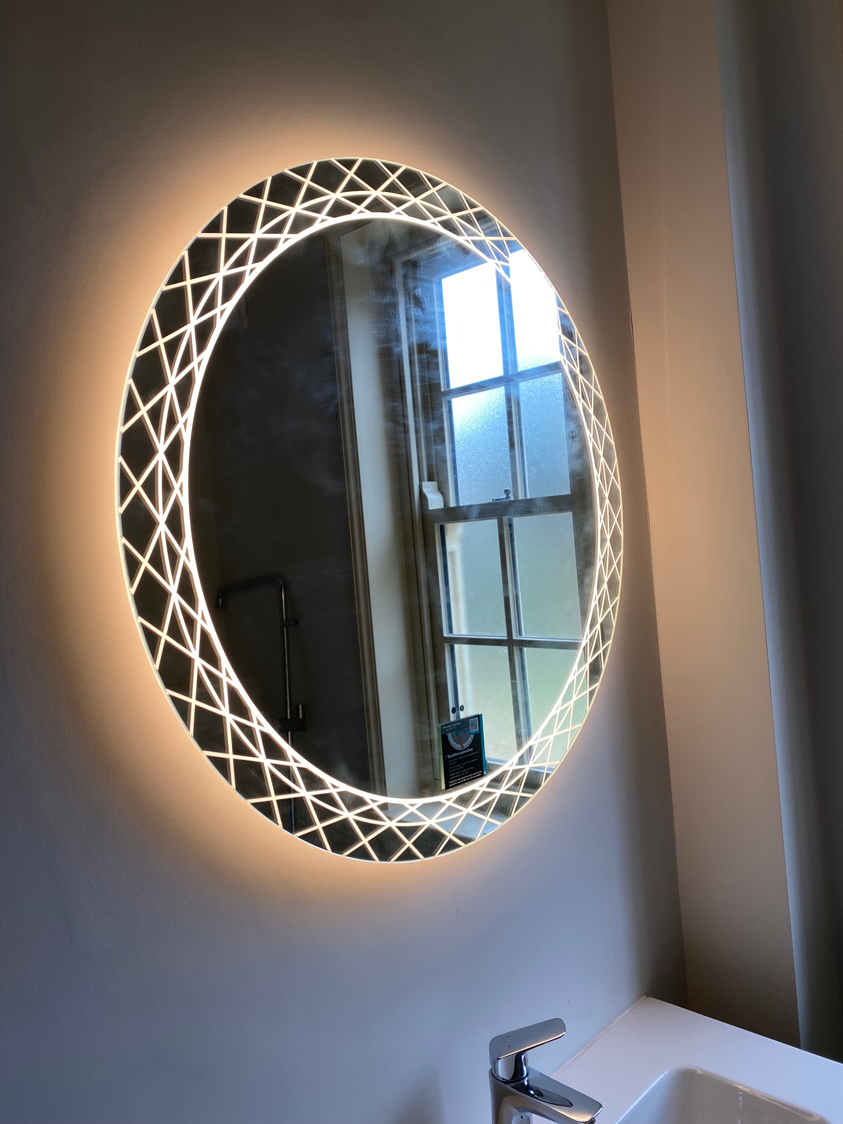 Illuminated geometric bathroom mirror